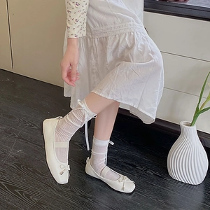 Sweet ballet style white ribbon bow socks paired with cream mary jane flat shoes