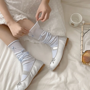 White semi-sheer balletcore crew socks with light blue bows and mesh breathable fabric