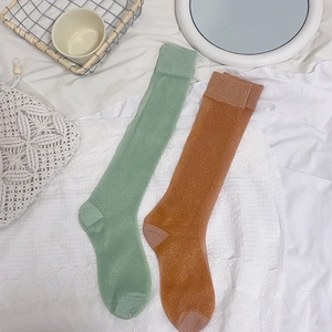 Lurex glitter knee-high socks in mint green and bronze orange with ribbed cuffs