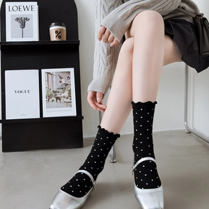 Japanese style black polka dot mid-calf socks with ruffle trim and cotton blend texture