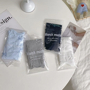 Detail of four pairs of ballet-style bow socks in light blue, grey, navy, and white