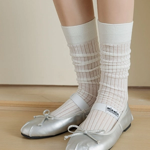 White vertical striped knee-high socks paired with silver ballet flats for a JK look