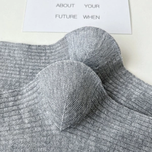Close-up of gray ribbed knit socks showing durable reinforced heel and toe texture