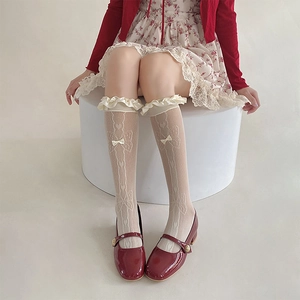 Lolita style lace calf socks in beige with butterfly patterns and ribbon bow detail