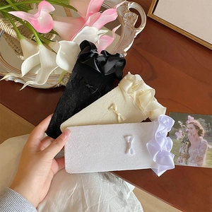 Detailed knit lace mesh socks featuring satin ruffled edges and sweet bow accents