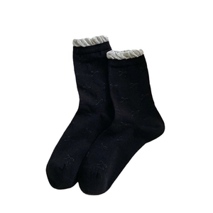 Sweet Japanese style black crew socks with white lace trim and bow jacquard pattern