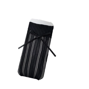 Jambières noires style ballet avec nœuds et rayures verticales en maille ajourée
