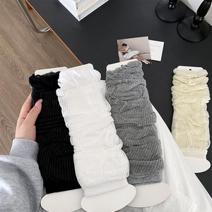 Close-up of four colors of lightweight Japanese style leg warmers with pleated texture