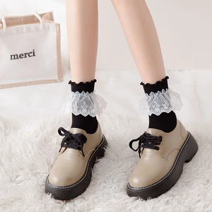Sweet Lolita white lace mid-calf socks paired with vintage khaki platform shoes