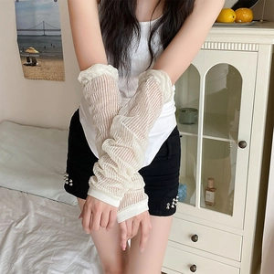 Detail of cream white pleated sun protection arm sleeves with breathable knit texture