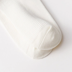 Detail of white rib-knitted cotton toe seam on Japanese Lolita style mid-calf socks