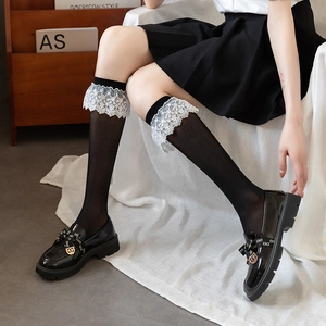 Lolita style black sheer lace socks paired with classic black patent leather loafers