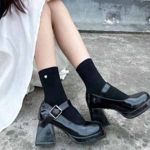 Classic black patent leather Mary Jane shoes with chunky high heels and platform soles