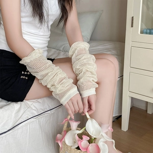 Close-up of cream pleated sun protection arm sleeves in breathable mesh fabric