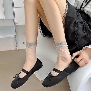 Sheer socks with grey bow cuff paired with black Mary Jane flats in sweet preppy style