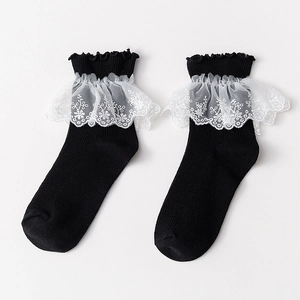 Japanese Lolita style black crew socks featuring elegant white floral lace trim details