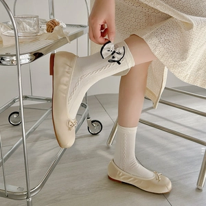 Bow-knot cable knit crew socks paired with cream ballet flats in feminine JK style