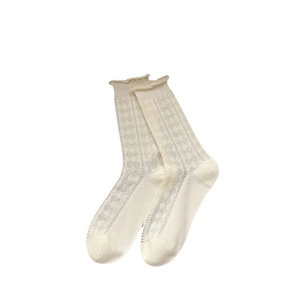 White hollow heart mesh socks for women featuring ruffled edges and diamond knit pattern