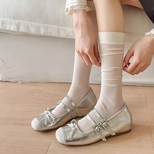 Japanese style white mesh socks paired with silver Mary Jane shoes for a casual college look