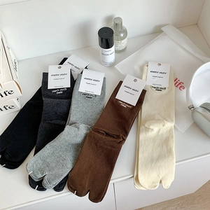 Detail of five-color split-toe Tabi socks with march much embroidered lettering