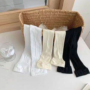 Detailed view of breathable mesh knee-high socks in white, beige and black colors