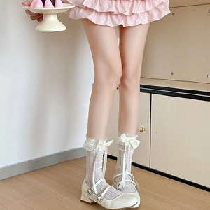 Detailed view of white heart mesh lace socks with silk bow and ruffled edges
