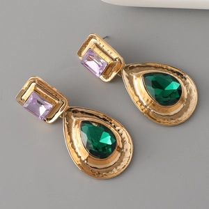 Vintage gold drop earrings featuring rectangular purple and emerald green crystals