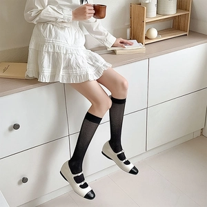Japanese style white calf-length mesh socks paired with stylish Mary Jane shoes
