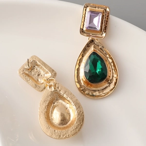 Vintage gold drop earrings with purple rectangular and green teardrop emerald crystals