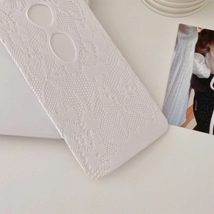 Detail of white hollow lace pattern with delicate crochet floral texture for women