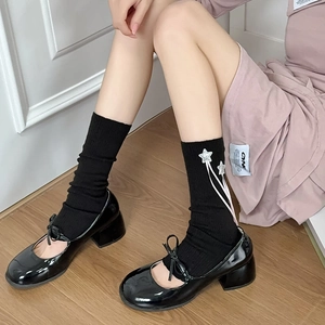 Pink Lolita style leg warmers with star embroidery and ribbons for sweet girl outfits