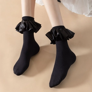 Elegant black Lolita style socks featuring ruffled satin edges and vintage lace details