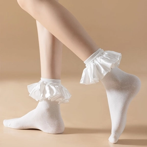 White cotton crew socks with glossy satin ruffle trim in a minimalist Japanese style