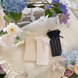 Lace mesh socks with bow ribbon and ruffle trim in white, cream, and black colors