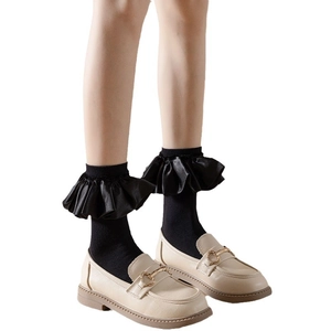 Japanese style black frilly lolita socks paired with beige leather heart buckle loafers