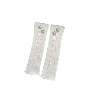 Sweet cream knit leg warmers with silver stars and pink ribbons in a 45-degree view