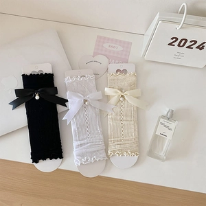 Three pairs of lace hollow mesh knee-high socks with silk bows and pearl charms