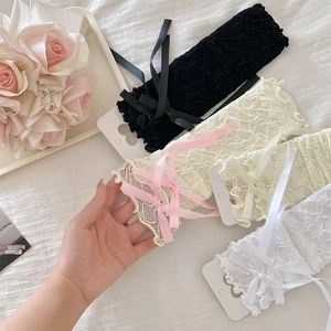 Detail of sweet lace leg warmers with ribbon bows and ruffle edges in four colors