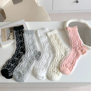 Five pairs of sheer tulle crew socks with delicate floral embroidery in pastel colors