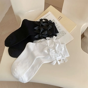 Japanese style Lolita socks in black and white with five satin bows on soft knit fabric