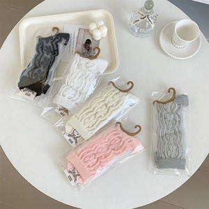 Detailed view of floral lace sheer socks in multiple colors with elegant retail packaging