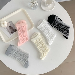 Detail of five pairs of floral lace sheer socks in pink, white, black, beige, and grey