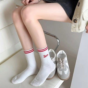 Sporty white crew socks with red double stripes and Three letter embroidery detail
