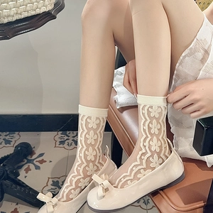 Floral sheer lace crew socks for women featuring white daisy patterns and wavy cuffs