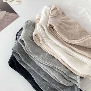 Detailed view of breathable ribbed cotton crew socks in diverse minimalist neutral colors