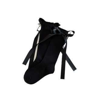 Japanese style black cotton knee-high socks featuring elegant oversized satin bows