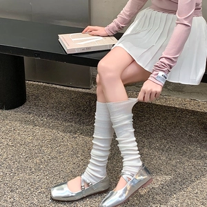 Detailed texture of white ribbed knit slouch socks with Japanese balletcore style aesthetic