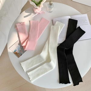Japanese style ribbed knit leg warmers in pink, white, and black with sweet lettuce edges