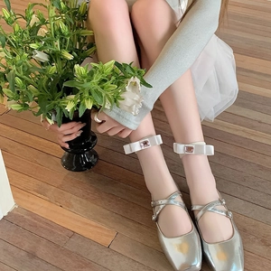 Silver metallic Mary Jane shoes with white satin bow anklets and pink jewel detail