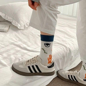 Artistic mid-calf cotton socks featuring blue abstract hand-drawn graffiti patterns